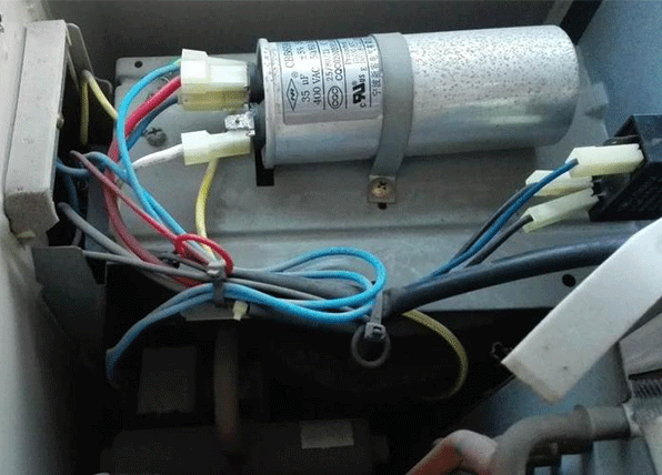 a capacitor in the heat pump outdoor unit